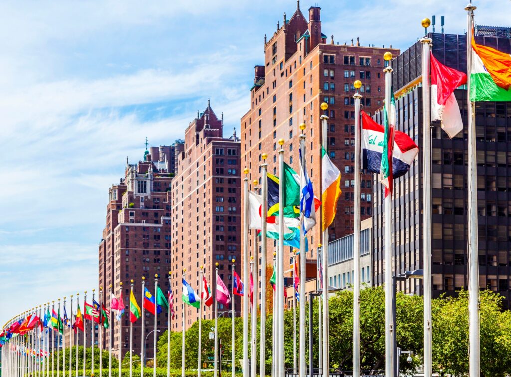 The United Nations Headquarters with flags of the members of the UN.