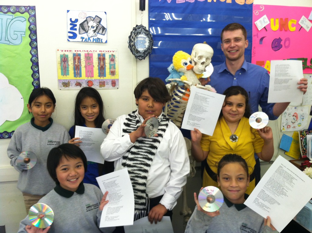 Tom McFadden with a San Jose classroom of science rappers debating "Is Pluto a planet?"