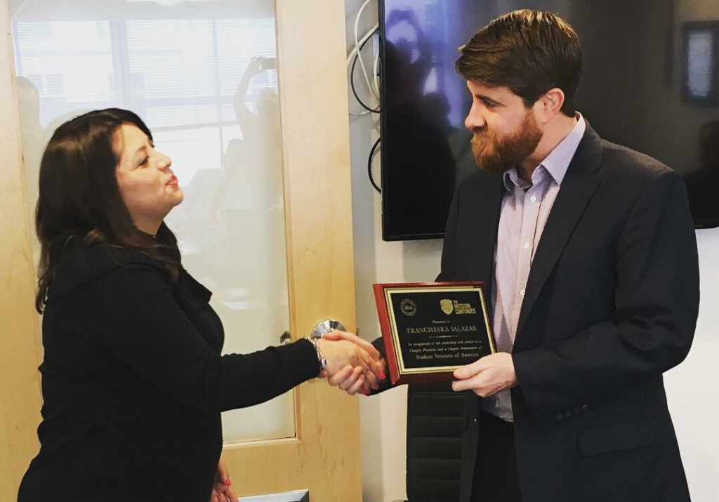 Francheska Salazar receiving an award from SVA President Jared Lyon