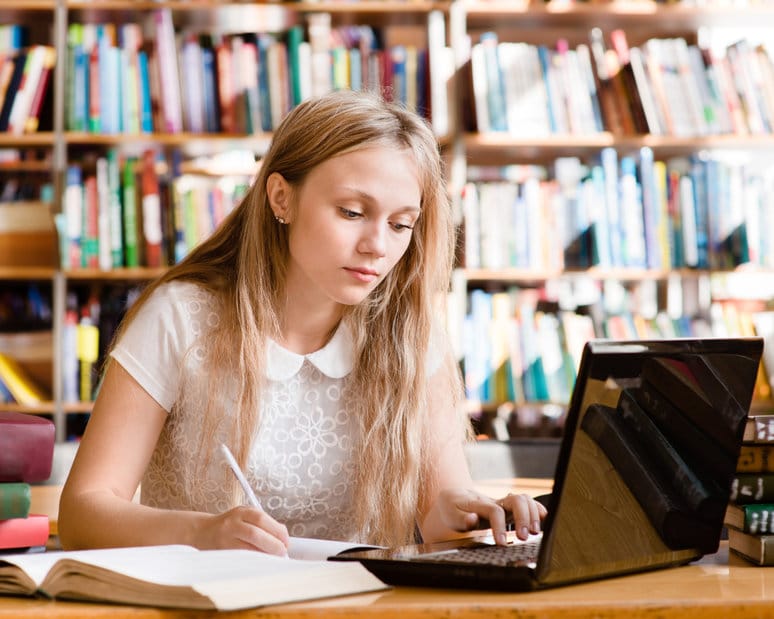 Woman typing a policy essay