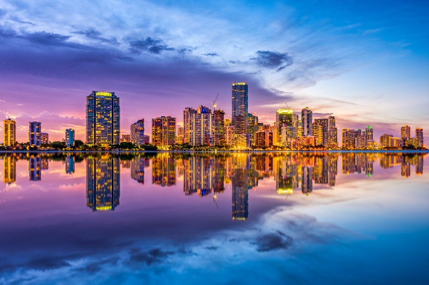 Colorful sunset over the Miami, Florida, USA skyline on Biscayne Bay.