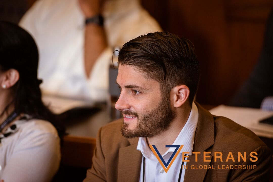 Photo of Nicholas Mancini's side profile at Veterans in Global Leadership seminar. 