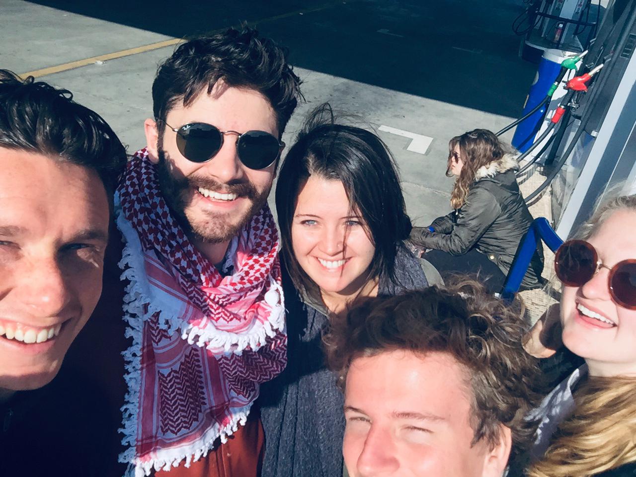 Nicholas Mancini smiling with a group of friends. 