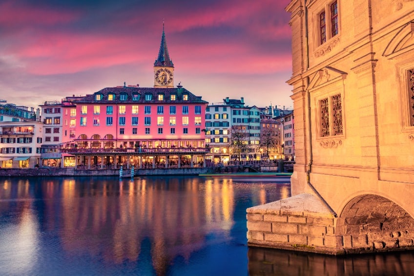 Adorable evening view of Zurich town hall. Fantastic summer cityscape of Zurich, Switzerland, Europe. Sunset on Limmat River. architectural background.