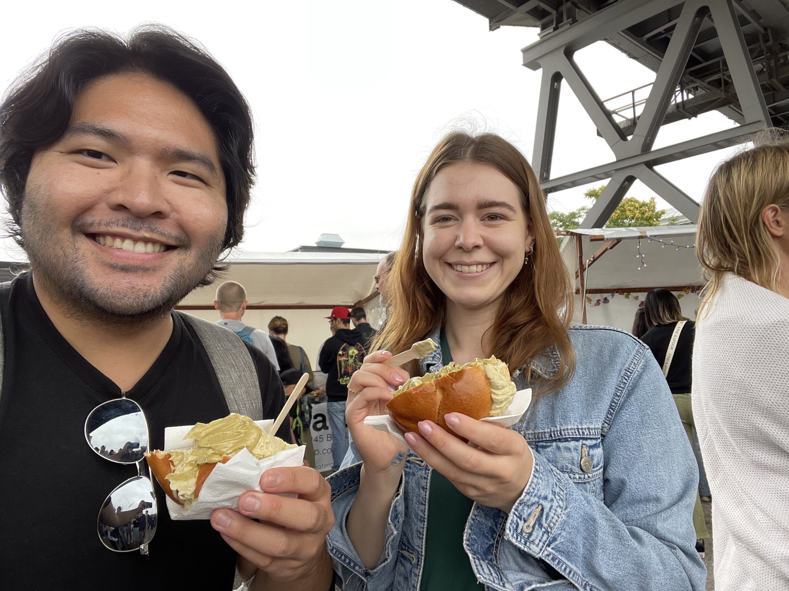 Tyler Pugeda smiling with Sarah, a native German scientist, at the Pistachio Festival in Berlin, Germany.