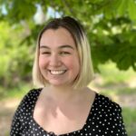 Dismas Family Farm Fellow Anna McCormack smiling in black shirt for headshot