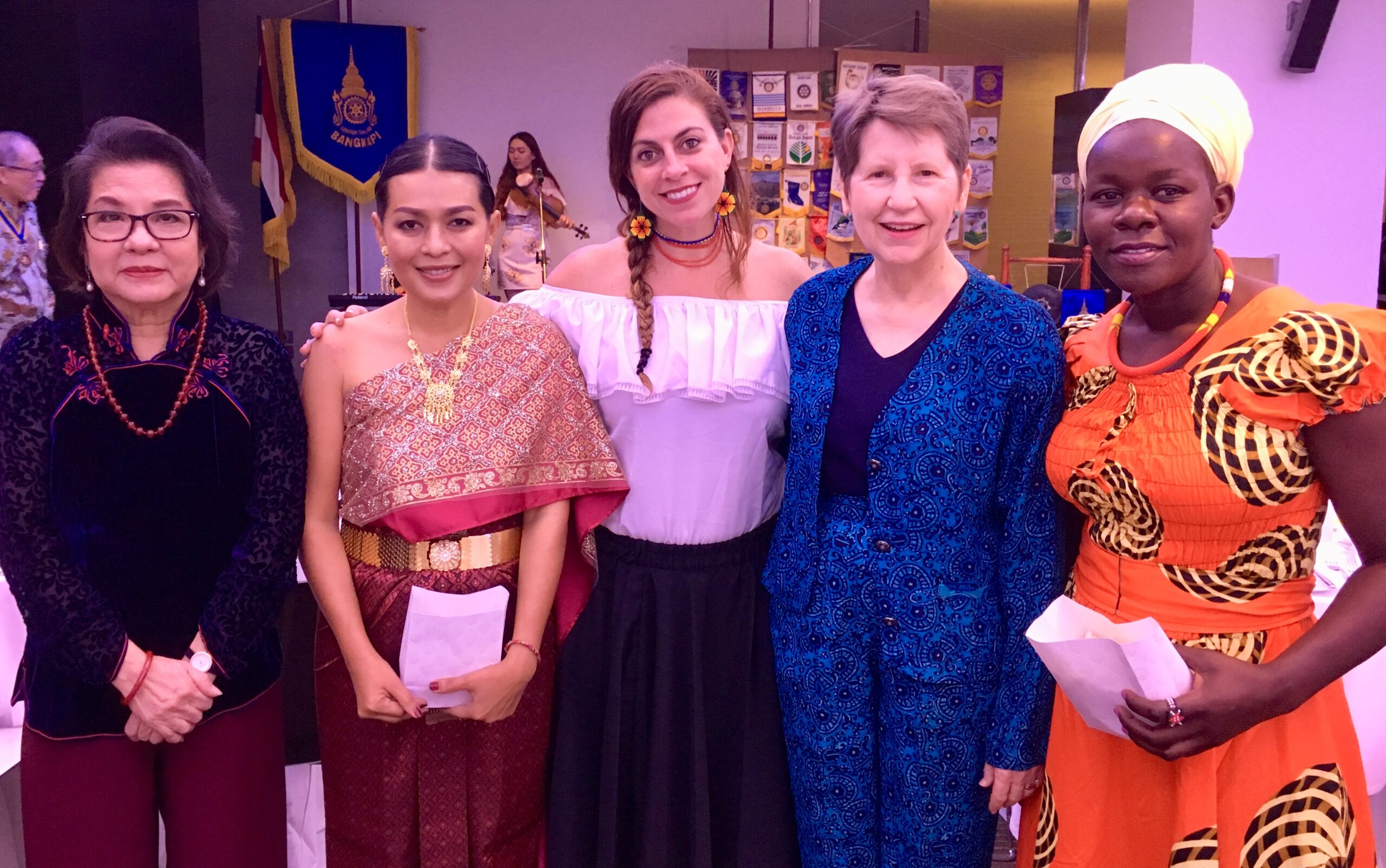 Rotary Peace Fellow María Antonia Pérez posing for a group photo with four other women at cultural night for the Rotary Peace Fellows and other members of the Rotary program.