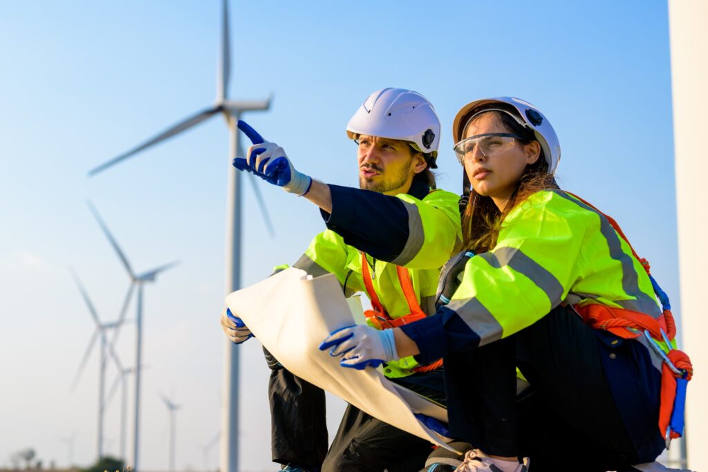 Renewable energy engineer working on wind turbine.