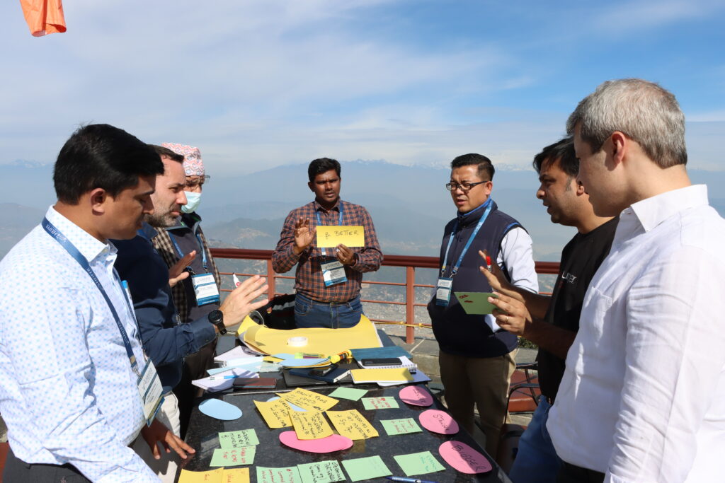 Dr. Benny Katta working with colleagues to develop a strategic vision to end poverty and hunger by 2030.