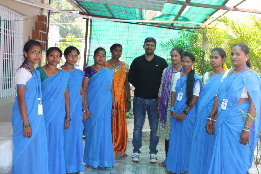 Dr. Benny Katta posing for a picture with women entrepreneurs who partnered with him to achieve sustainability goals in 6 months.
