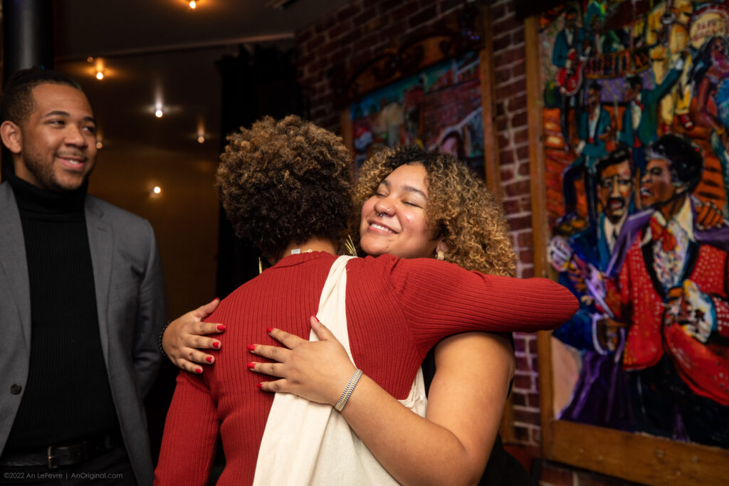 Yolanda Martí embracing Portia Singh at Fundraising Soiree