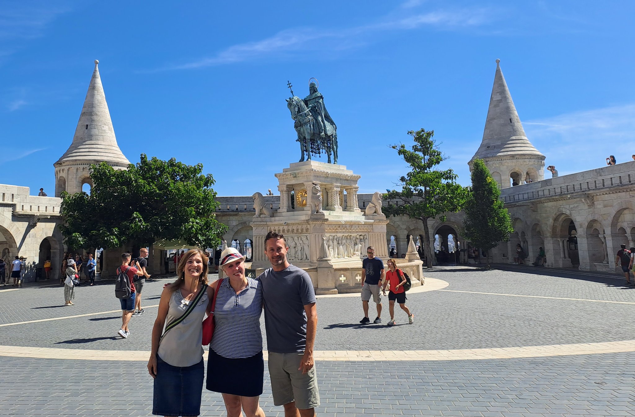 Kelli Buzzard, Budapest Fellow, posing for a group photo in a scenic square in Budapest Hungary.