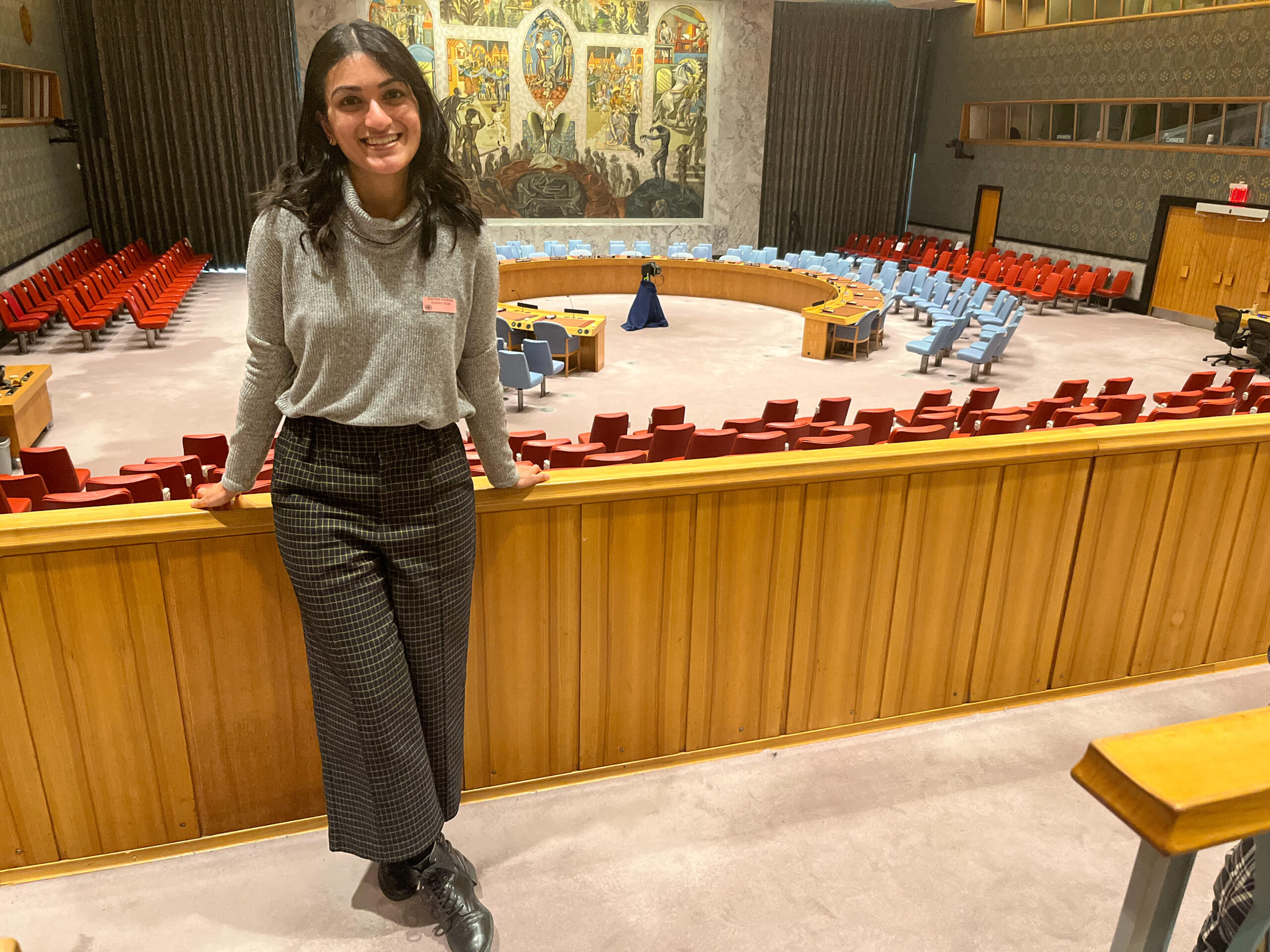 Nisha Shankar smiling at the United Nations Headquarters in New York City.