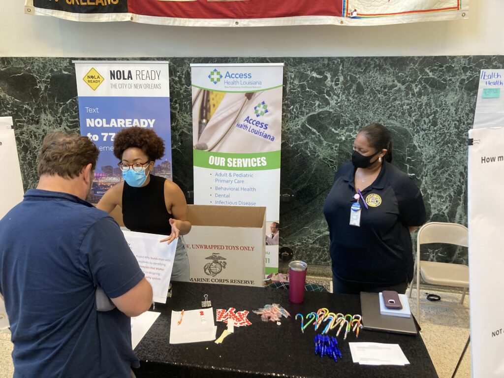 During her City Hall AmeriCorps service year, Juanita Gordon spoke with residents at a tabling event.