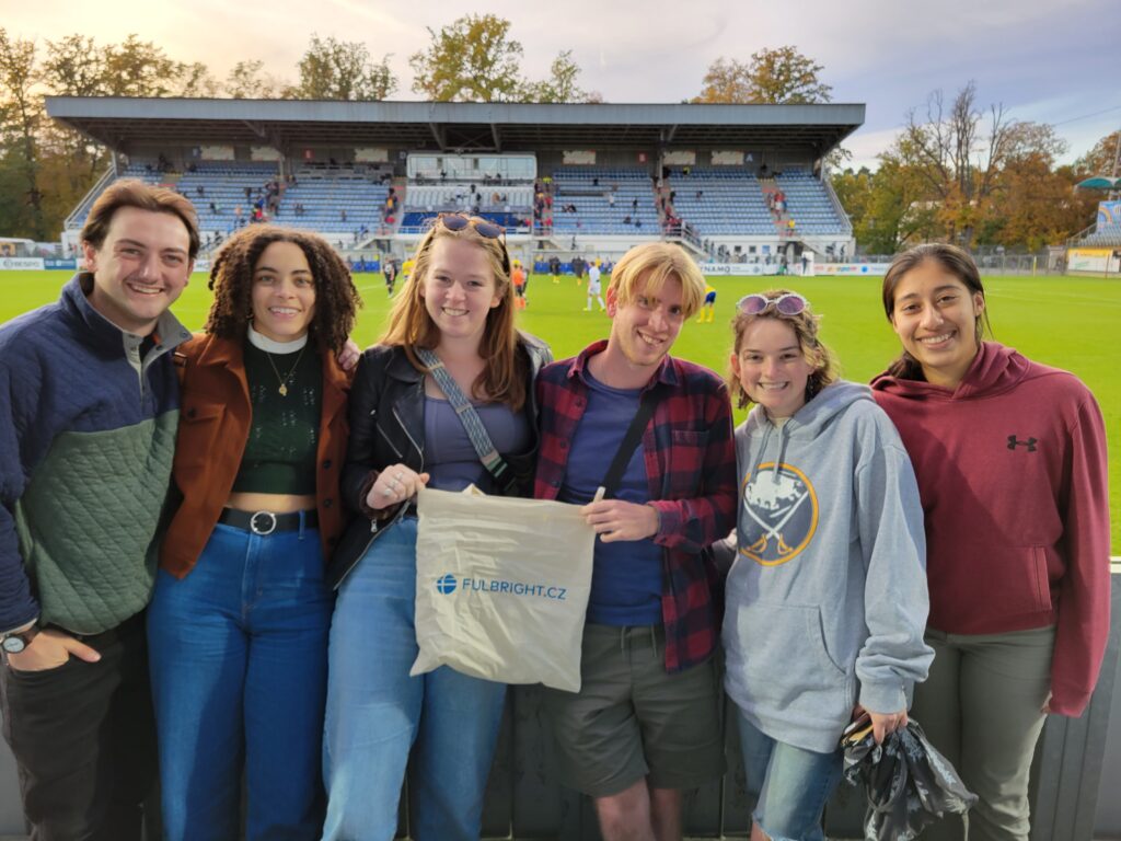 Magaly Cabrera-Ortiz in group photo wat Nest reunion soccer match