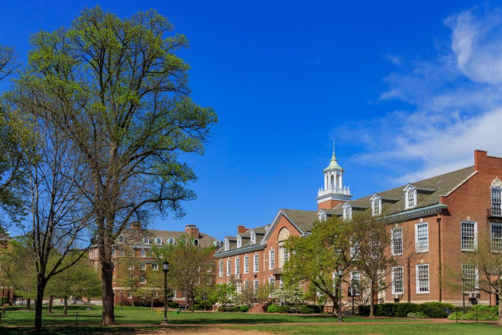 A photo of Maryland Hall in the Wyman Quad of Johns Hopkins University Homewood Campus in Baltimore, Maryland, United States. John's Hopkins University offers a fully funded Master's in Nursing.