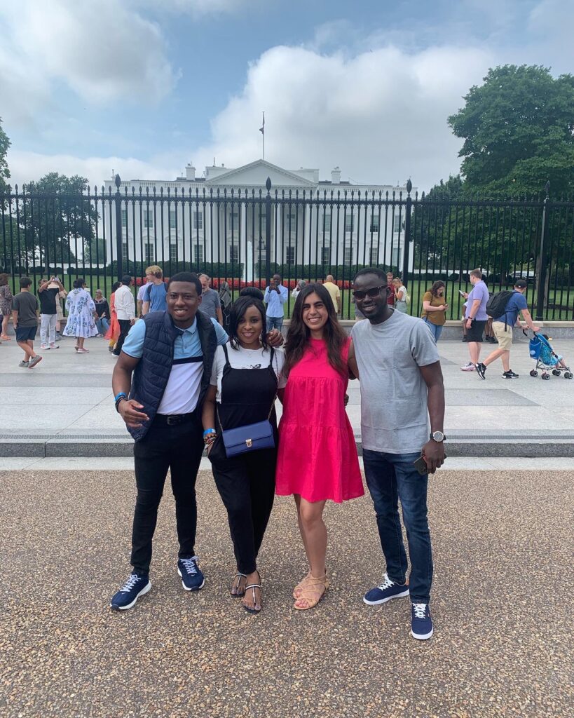 Racheal Inegbedion posing with two other fellows of the Mandela Washington Fellowship, and a fourth person in Washington DC, outside the White House