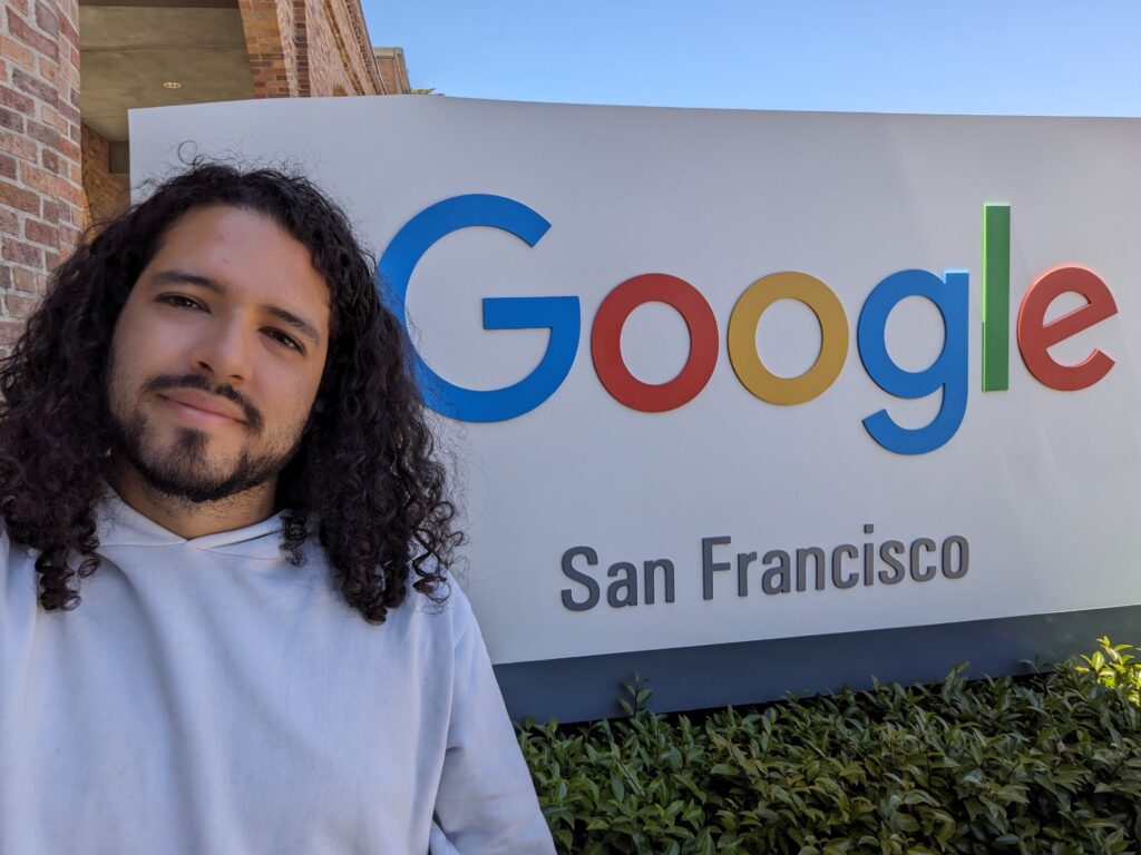 EDF Climate Corps Fellow Daniel González standing in front of the Google sign in front of the Google office in San Francisco