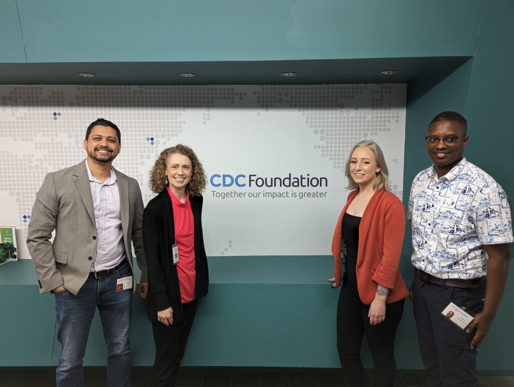 Humphrey Fellowship winner Monzur Patwary, standing to the far left wearing a gray dress jacket, visiting the CDC Foundation with another Hubert H. Humphrey fellow.