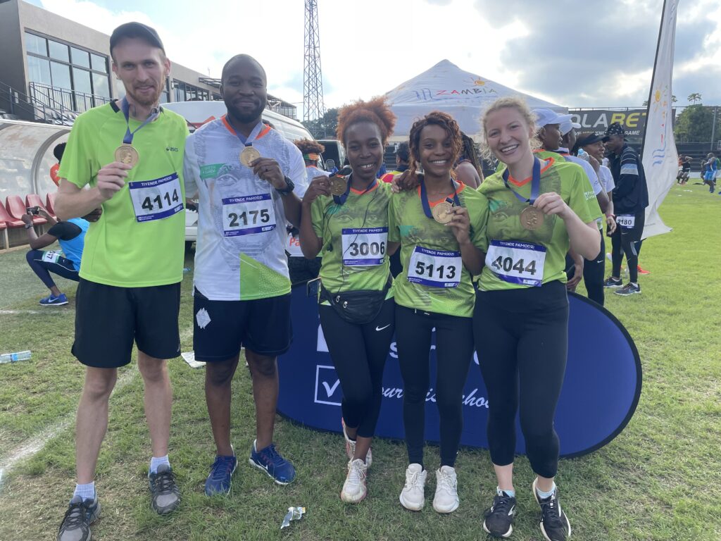 Joanna Bascom (far right) with friends after running the Kenneth Kaunda Day half marathon in Lusaka.