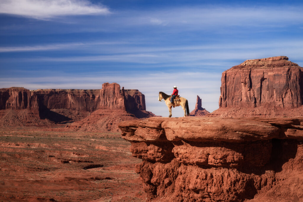 beautiful scene of Native American sitting on a horse in Monument Valley, Utah - Arizona State, America. The image represents one of the fellowships with upcoming deadlines for Native American college students