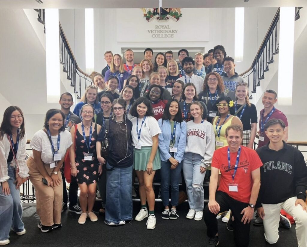 A group photo including Lily Mott and the full cohort of 2023-2024 US-UK Fulbright Scholars inside the Royal Veterinary College in London, England.